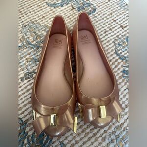 Mel Dreamed by Melissa -  Love jelly flats in rose gold with a bow detail